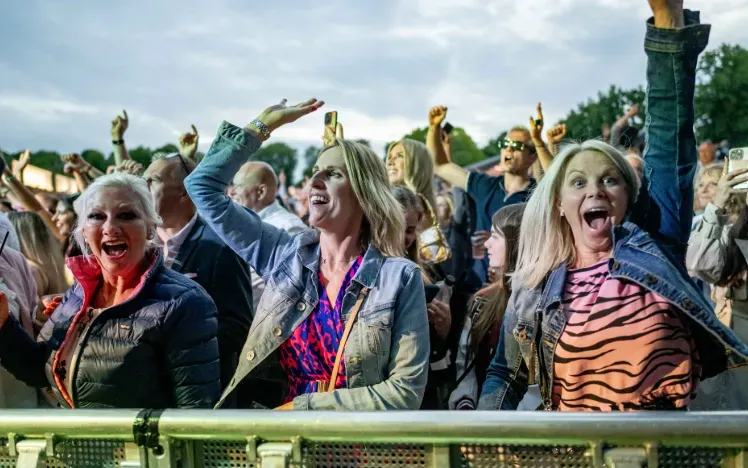A group of women enjoying the live music at Windsor Races