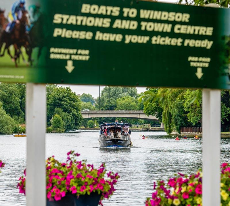 A boat sails down the river towards the camera