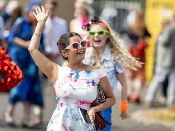 Two ladies enjoy the pre-race entertainment at Windsor