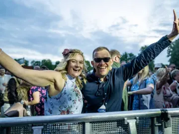 Two race goers at Windsor enjoying live entertainment