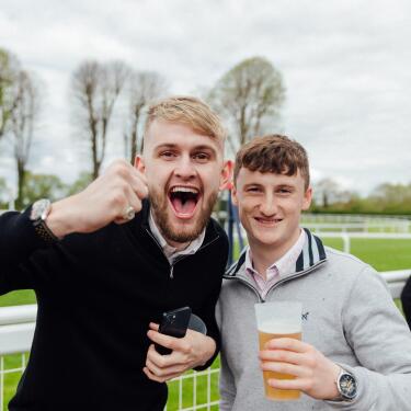 Two racecourses smile and cheer for the camera at Windsor Races Gents Day