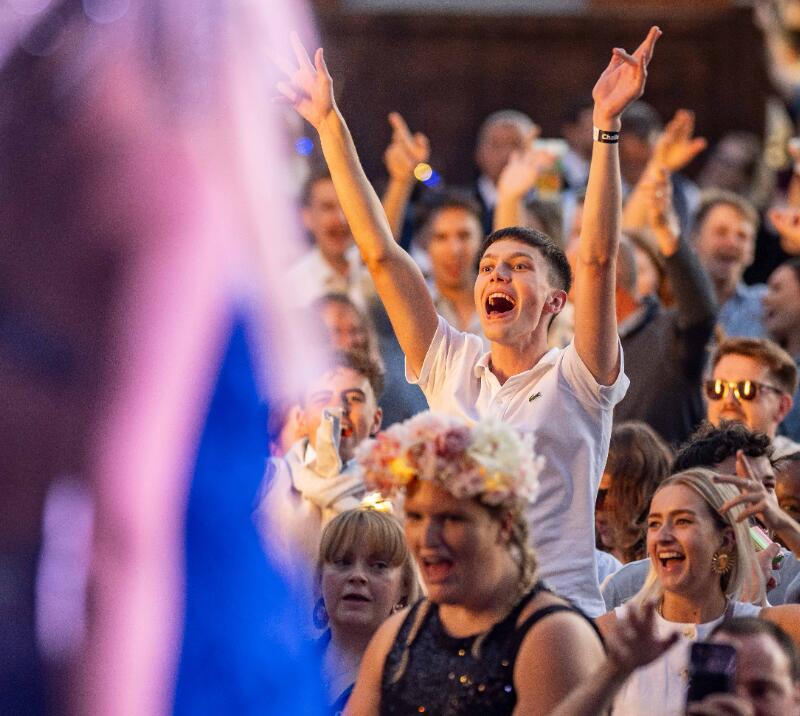 A race goer sings enthusiastically to the music at Windsor Races