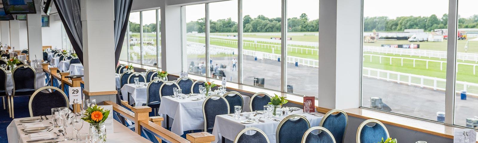 Dining tables all prepared in a stunning interior space