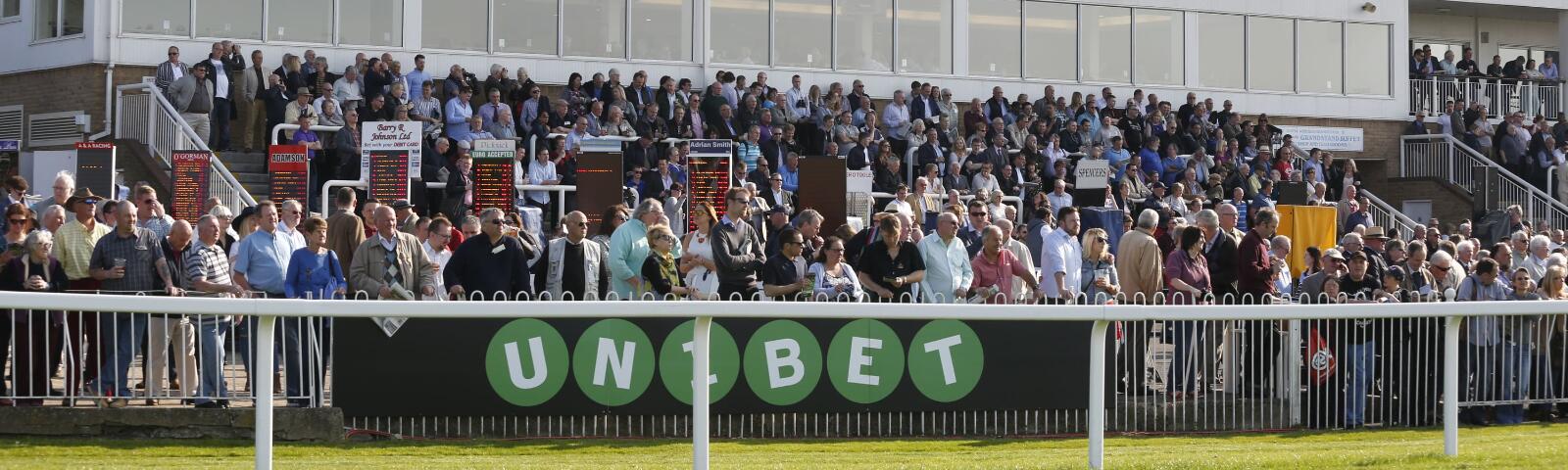 The grandstand at Windsor with a line of bookmakers