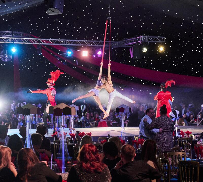 Circus performers performing for a Christmas Party hosted by Best Parties Ever