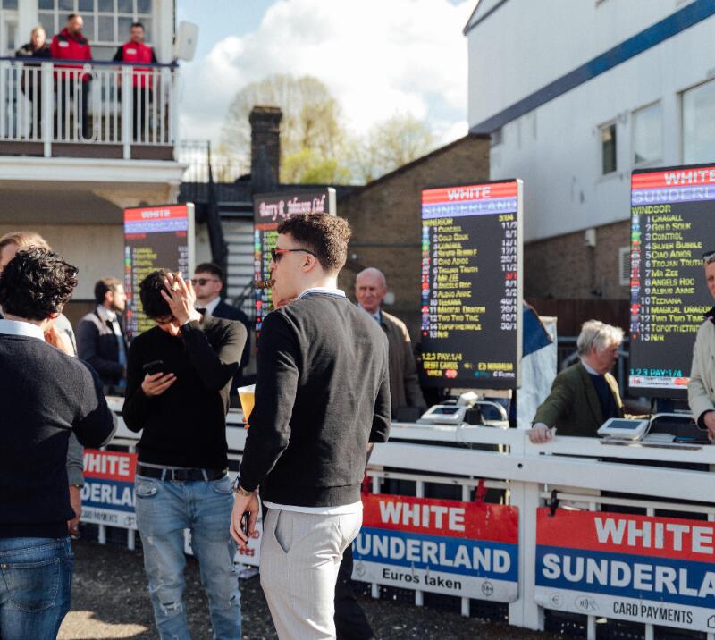 A row of bookmakers showing odds at Windsor