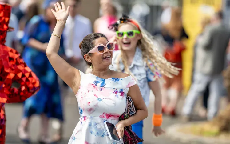 Two ladies enjoy the pre-race entertainment at Windsor