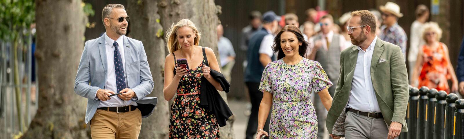 Race goers walking into Windsor Racecourse for a race day