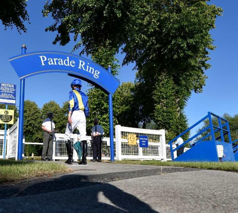 Jockey's enter the Parade Ring at Windsor Racecourse
