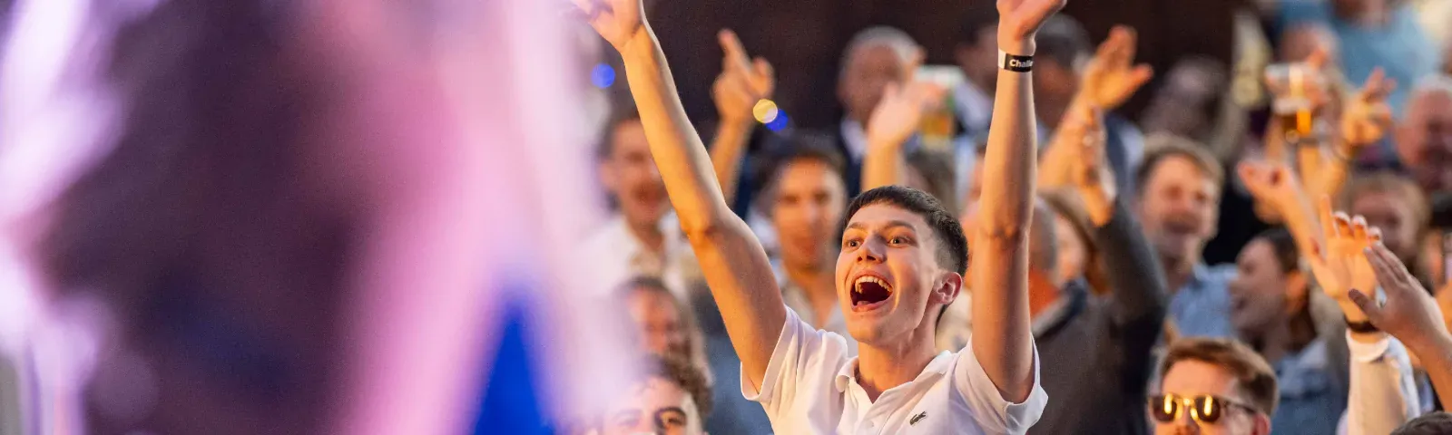 A race goer sings enthusiastically to the music at Windsor Races