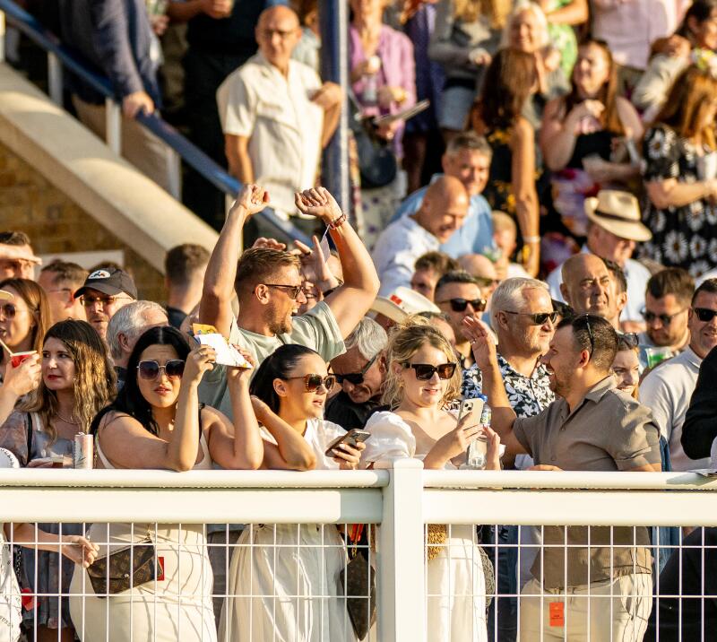 Some of the crowd at Windsor races cheer for a win